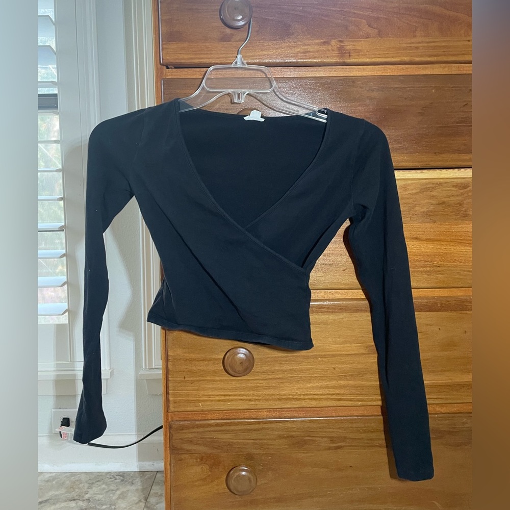 Black long sleeve crop top with cross over front.
